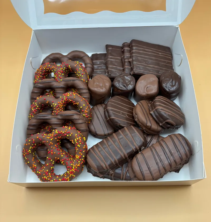 Seasonal corporate gift box with fall-colored sprinkle pretzels and chocolate bars by A Touch of Chocolate