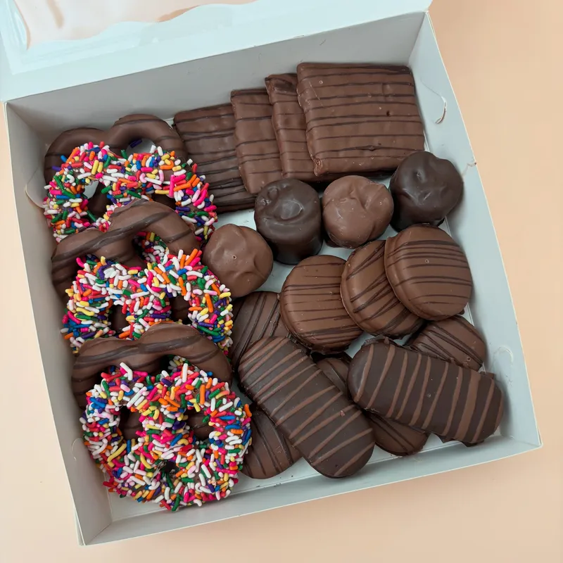 Corporate gift box of A Touch of Chocolate handcrafted treats with rainbow sprinkle pretzels, chocolate-dipped grahams, and marshmallows